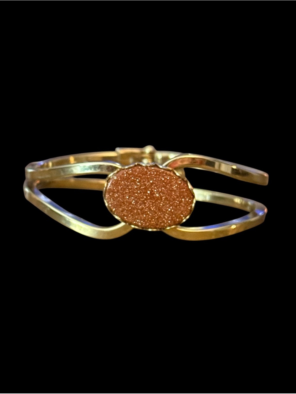 Vintage gold tone goldstone open work clamper bracelet